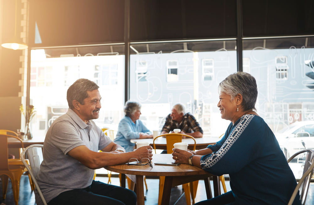 Weve been through thick and thin together. a senior couple out on a date at a coffee shop. 50-65 couple out for coffee